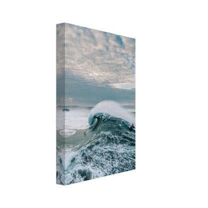 Big Wave Surfing Canvas Print showcasing a surfer riding a massive wave, capturing ocean beauty and adventure.