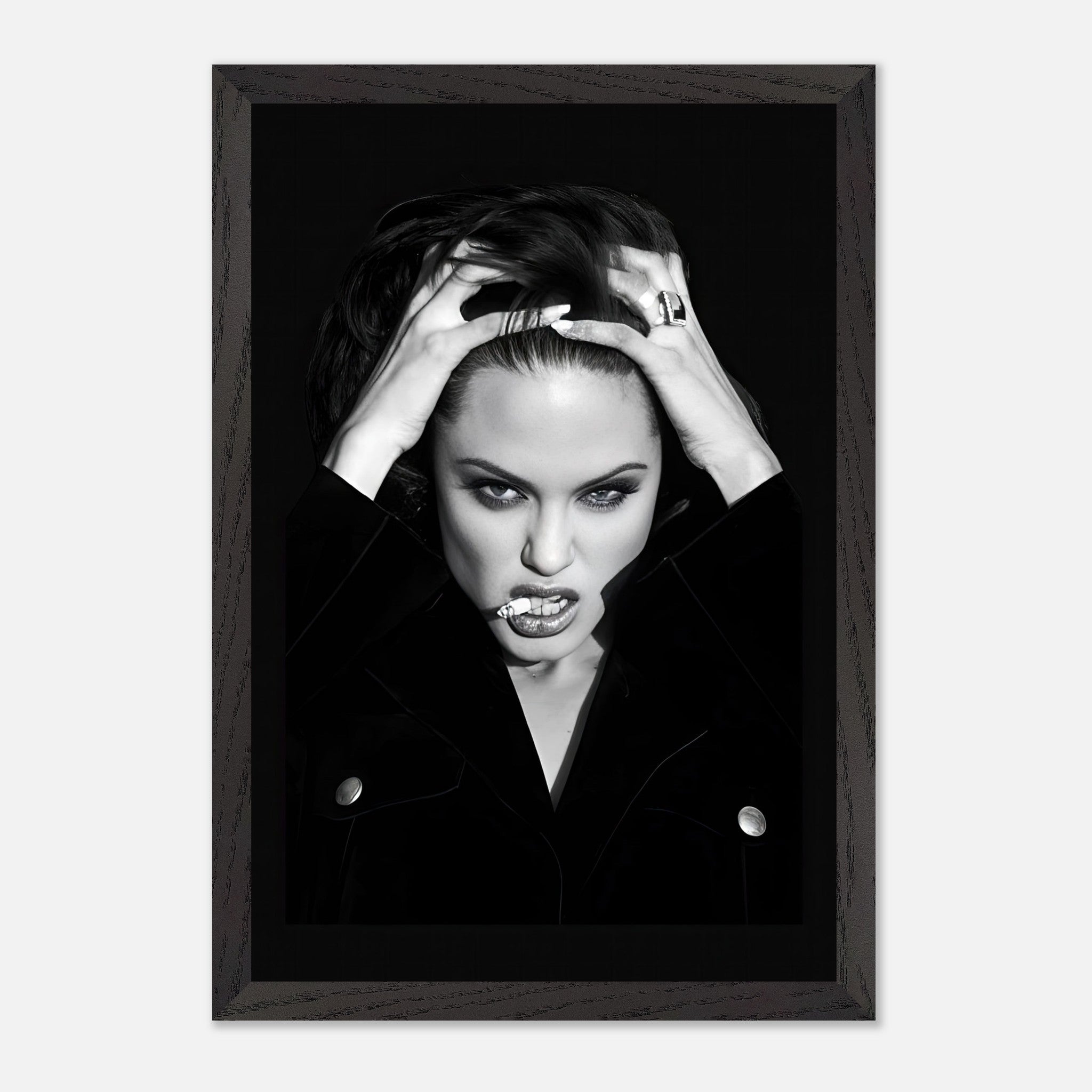 Vintage framed print of Angelina Jolie smoking, showcasing her bold attitude in a striking black-and-white photograph.