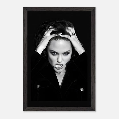 Vintage framed print of Angelina Jolie smoking, showcasing her bold attitude in a striking black-and-white photograph.