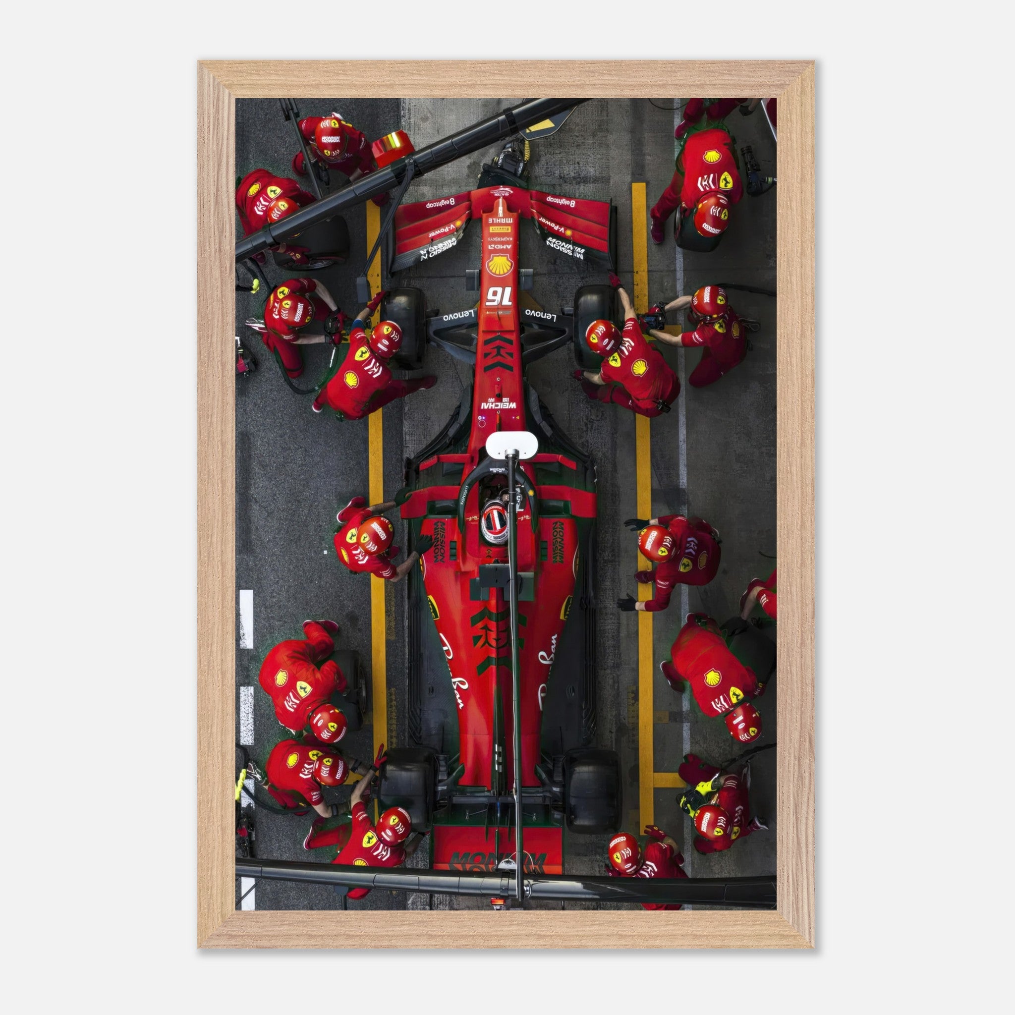 Ferrari Formula 1 pitstop framed art print showcasing teamwork and precision of the pit crew in vibrant colors.