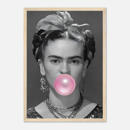 Frida Kahlo framed print featuring a black and white portrait with pink bubble gum, adding playful charm to any space.