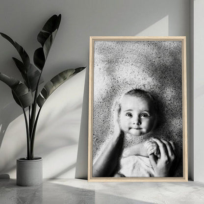 Black-and-white baby bath photography framed canvas print featuring a smiling baby surrounded by bubbles.