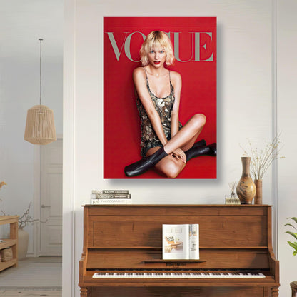 Taylor Swift Vogue poster featuring vibrant red background, stylish pose, and elegant fashion decor in a cozy living space.