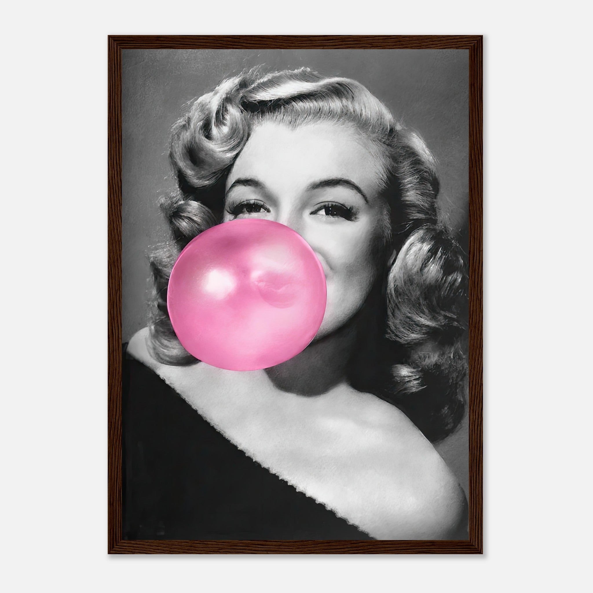 Marilyn Monroe framed print blowing pink bubble gum, adding sass and glamour to your wall decor.