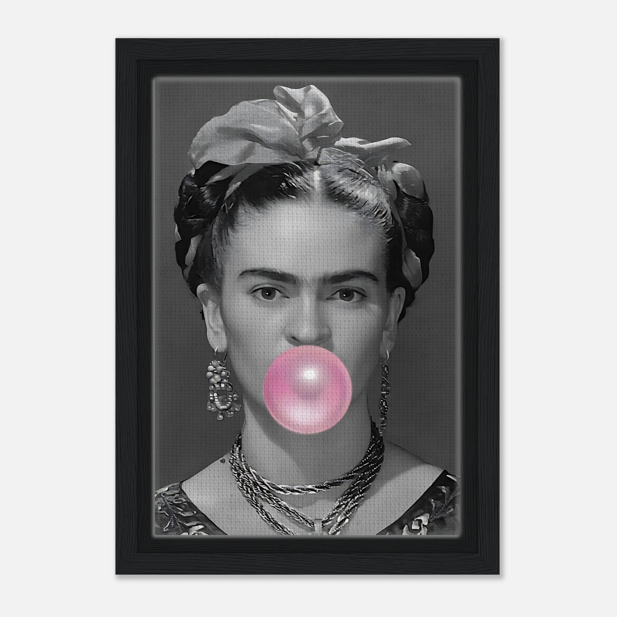 Frida Kahlo portrait blowing pink bubble gum in a framed canvas print with natural wood finish.