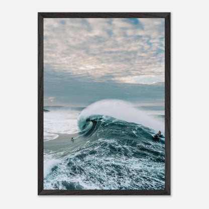 Big Wave Surfing Vintage Framed Print featuring a surfer riding a massive wave in a dramatic ocean scene.