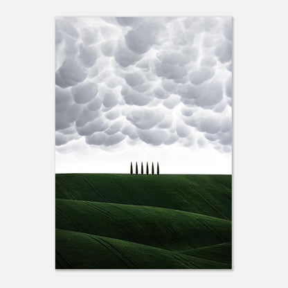 Rolling emerald hills with cypress trees under a dramatic cloudy sky in Tuscany, Italy metal print artwork.