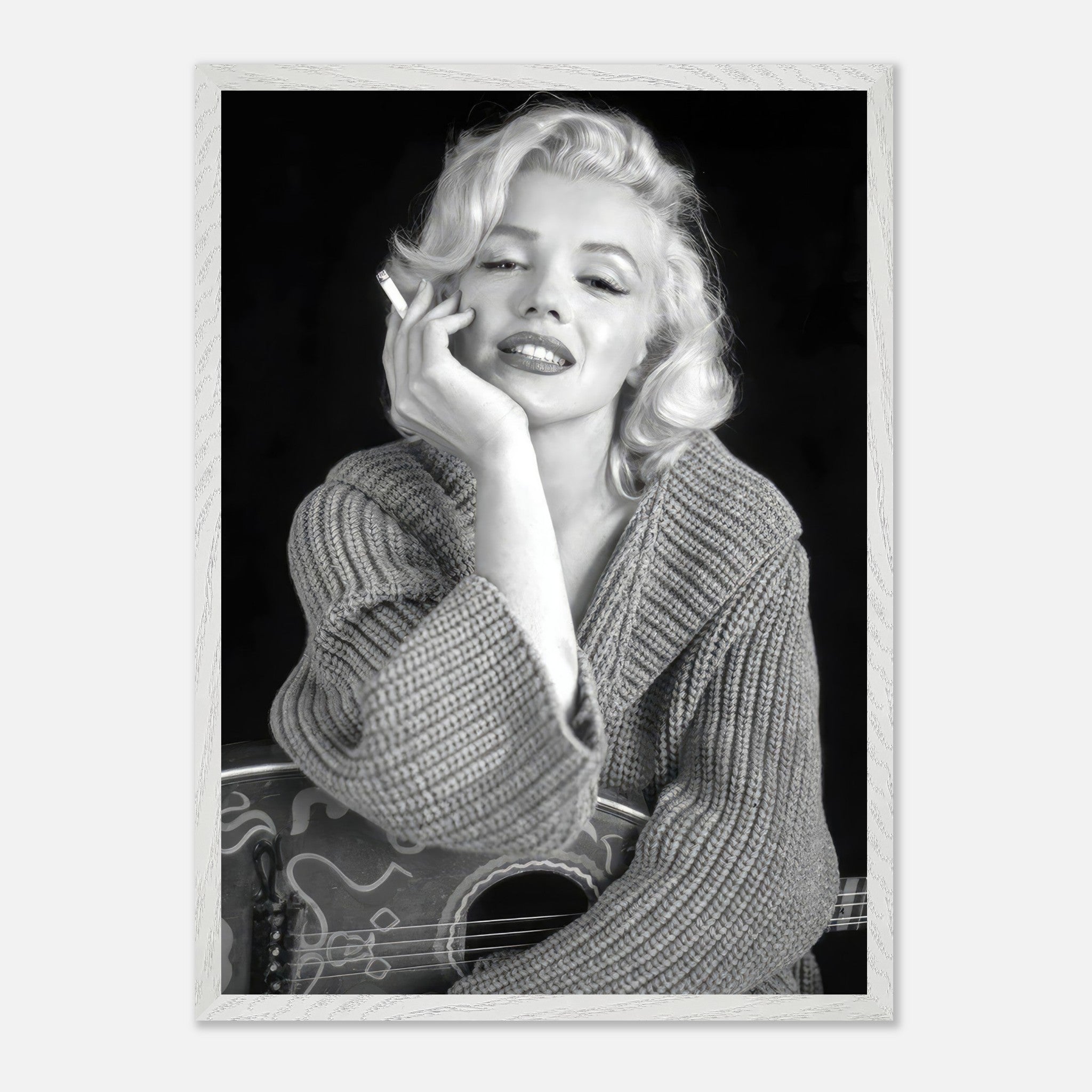 Marilyn Monroe smoking in a cozy sweater, captured in a timeless black-and-white vintage framed print.