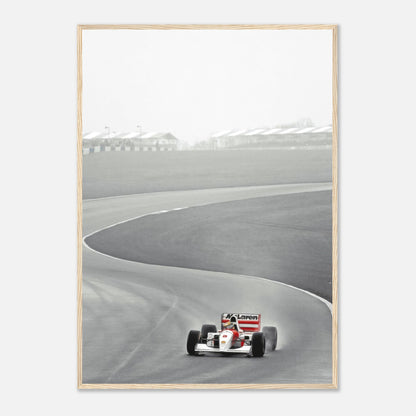 1988 Ayrton Senna McLaren MP4/4 framed print capturing Senna on track in black and white.