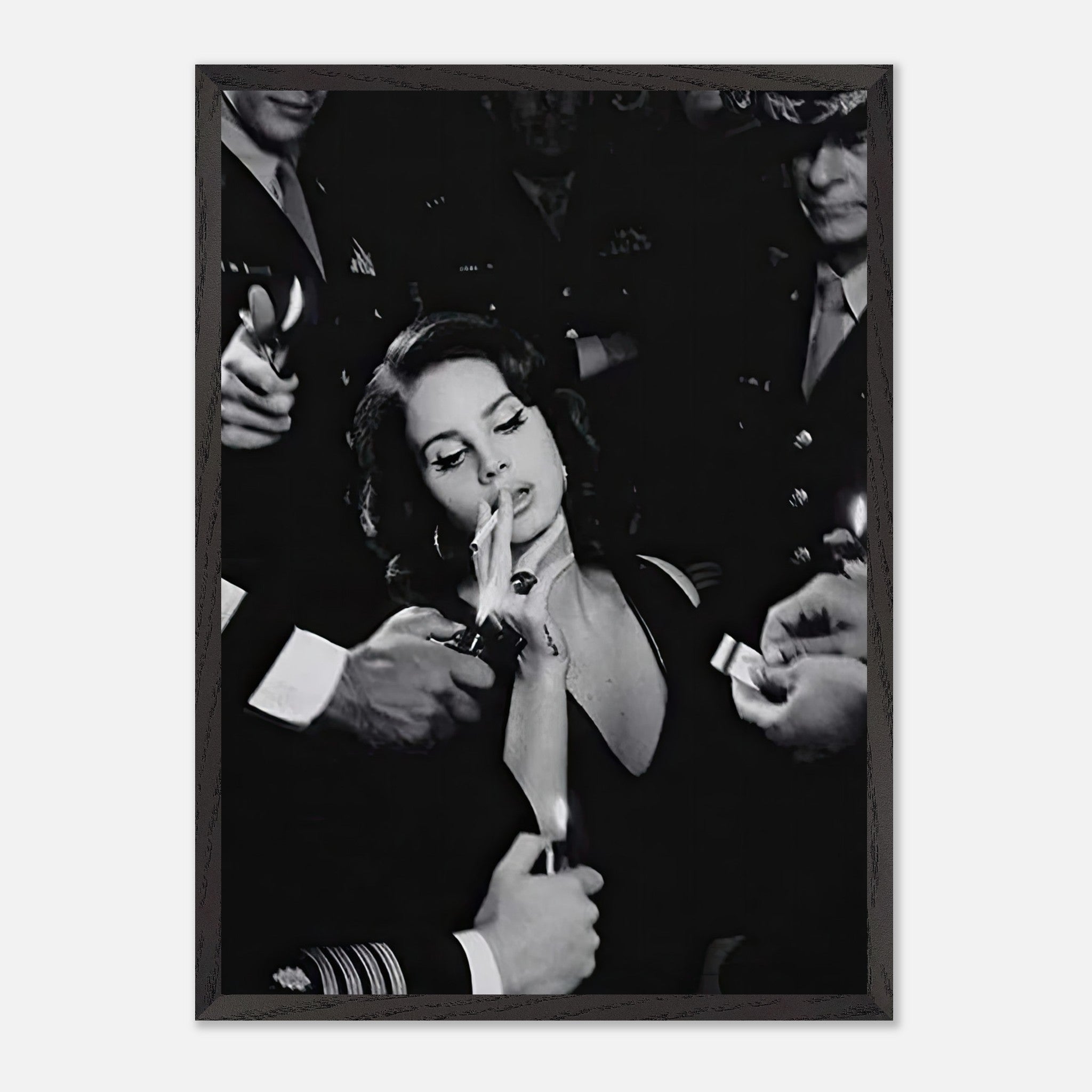 Vintage framed print of a woman smoking surrounded by people, capturing timeless elegance and iconic black-and-white charm.