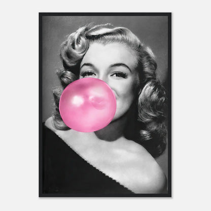 Marilyn Monroe blowing pink bubble gum in a black and white framed print, adding glamour and quirk to any décor.