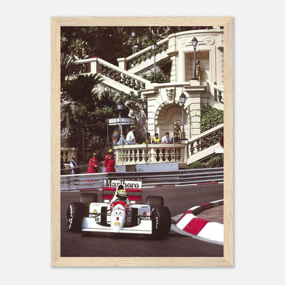 Ayrton Senna racing at Monaco Grand Prix, framed print showcasing iconic moment with vibrant colors and intricate details.