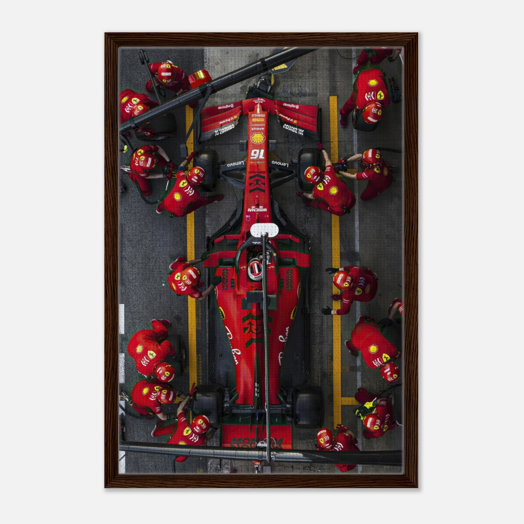 Framed canvas print of a thrilling Ferrari Formula 1 pitstop with vibrant colors and dynamic team action.