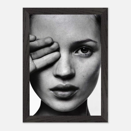 Black and white framed print of a woman's portrait with hand covering eye, exuding elegance and sophistication.