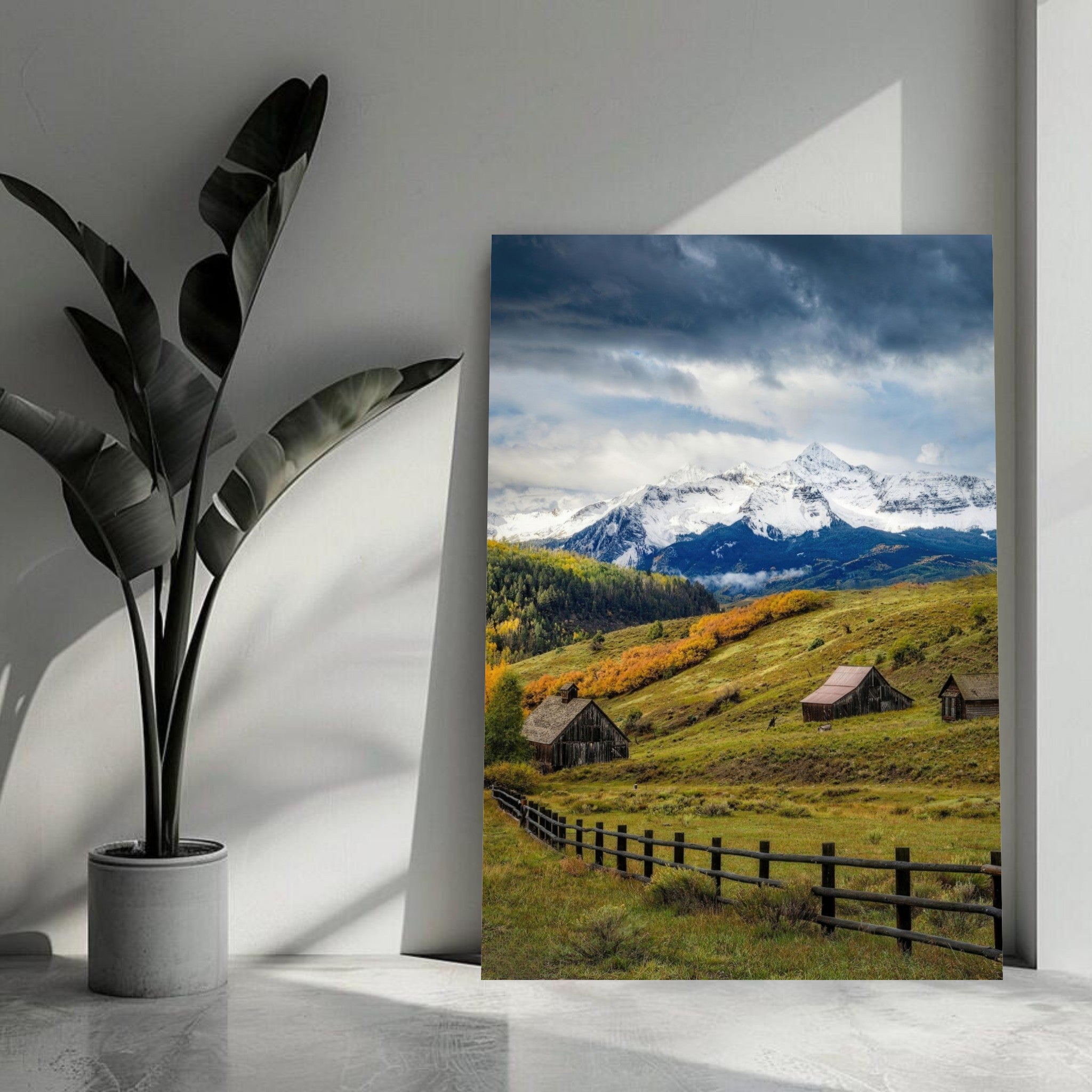 Telluride, Colorado metal print featuring snow-capped mountains, rustic barns, and autumn foliage under a dramatic sky.