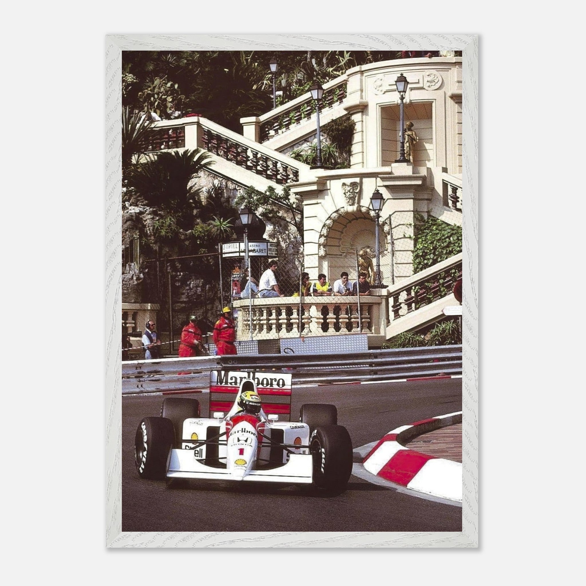 Ayrton Senna during a race in Monaco, captured in a fine art print featuring iconic McLaren car on a scenic street.