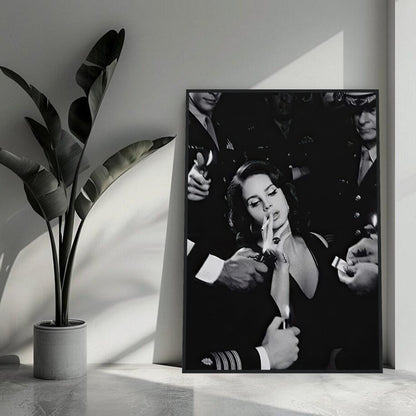 Black-and-white framed print of a woman smoking, surrounded by vintage-styled figures, adding elegance to any space.