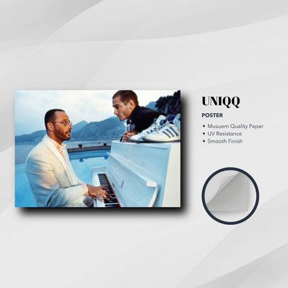 Jean Reno Piano Poster featuring a musician at a white piano with coastal backdrop, perfect for elegant decor.