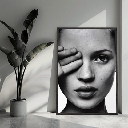 Kate Moss black and white framed print showcasing elegance in a modern interior with plant decor.