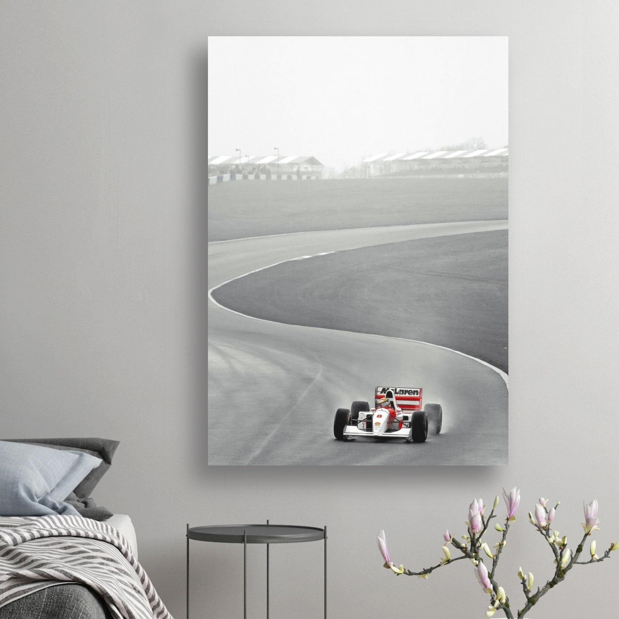 1988 Ayrton Senna McLaren poster featuring the iconic MP4/4 racing around a track, in a minimalist design.