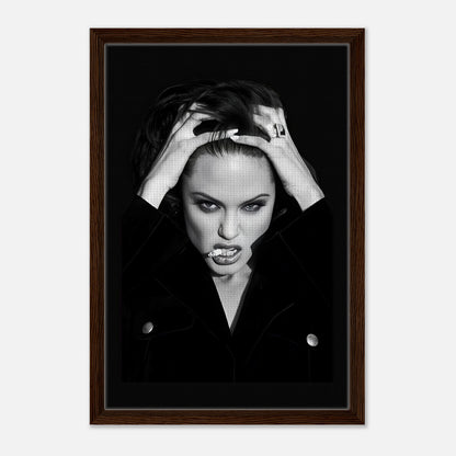 Framed canvas print of Angelina Jolie exuding elegance and rebellion, perfect for stylish home decor.