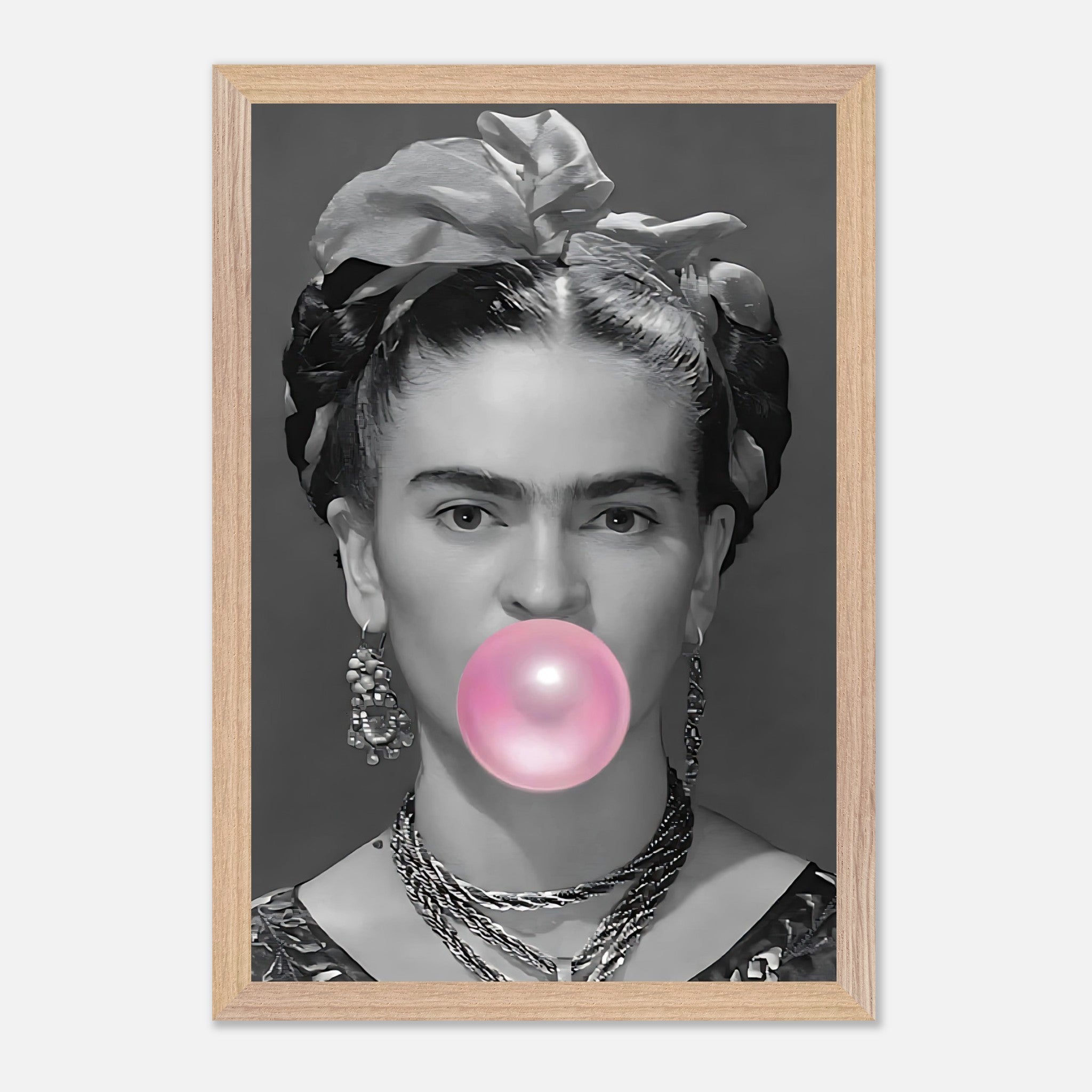 Frida Kahlo vintage framed art blowing bubble gum in playful pink, combining elegance with modern decor style.