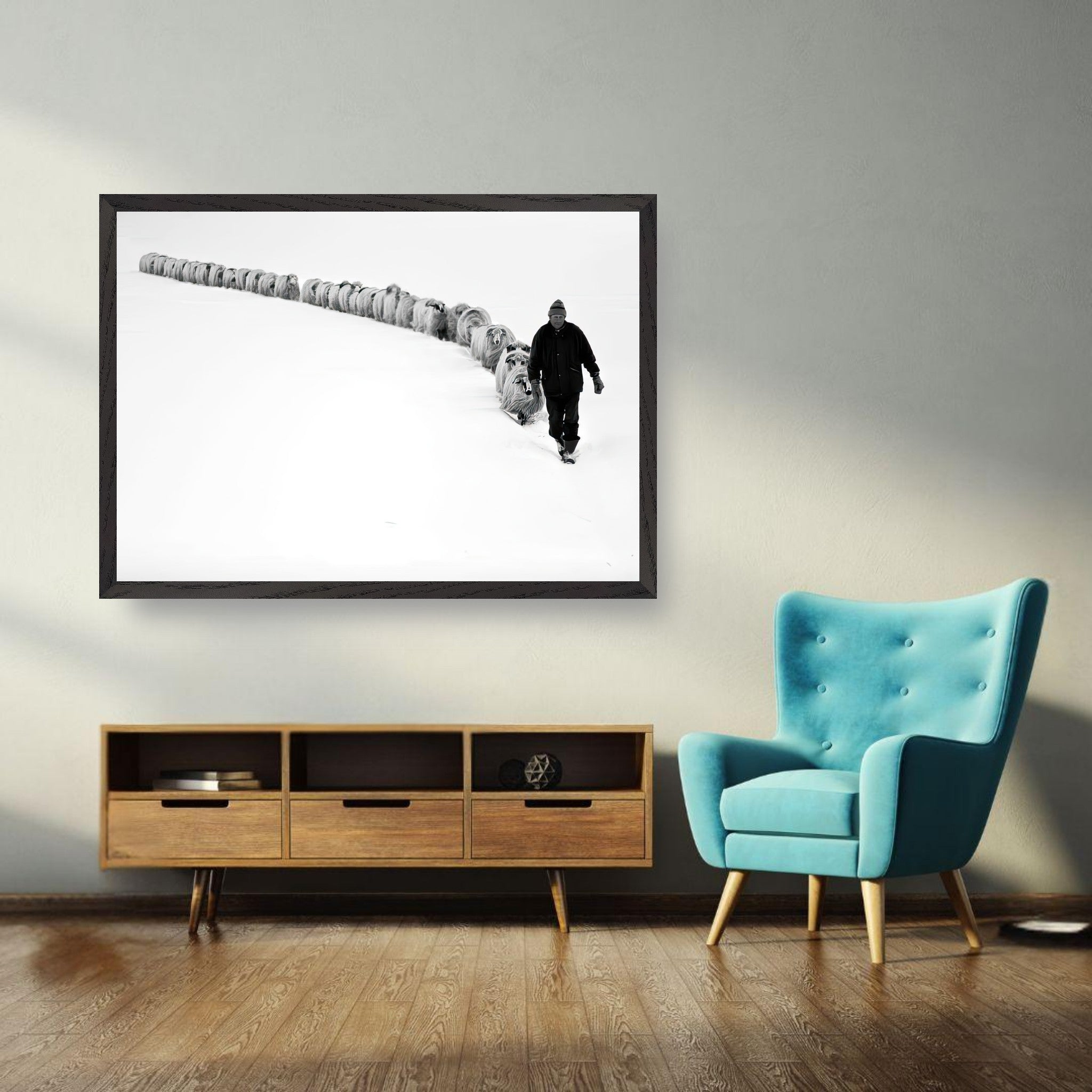 Fine art print of a shepherd walking through snow with his flock, showcasing resilience and tradition in a minimalist style.