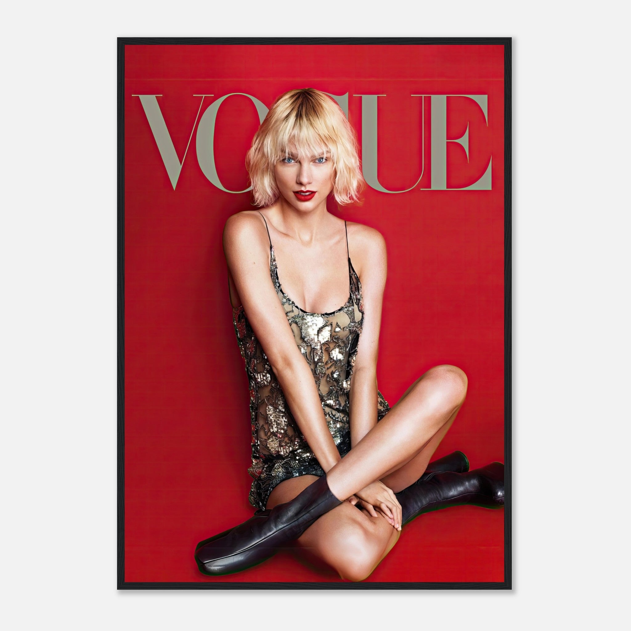 Taylor Swift Vogue framed poster features her in a sequined dress against a striking red background. Perfect for fans.