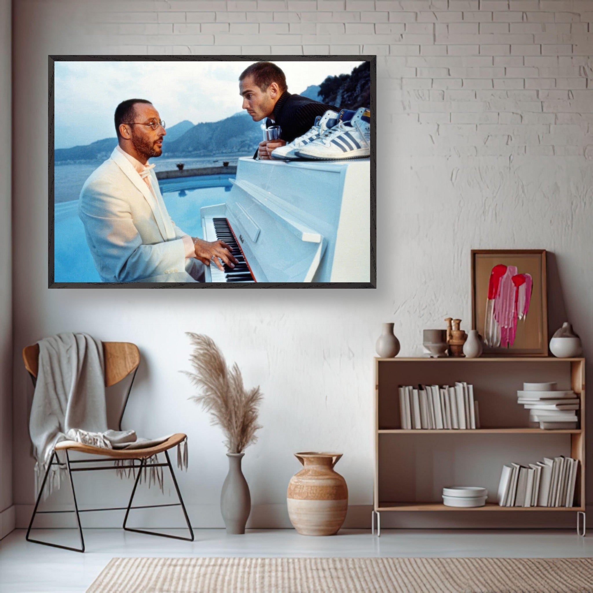 Jean Reno playing piano in a serene seaside scene from "The Big Blue," framed print for classic cinema lovers.