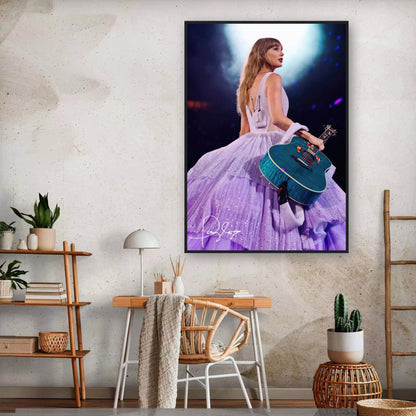 Taylor Swift framed poster in lavender gown, showcasing her with a guitar under spotlight for fans. Taylor Swift Poster, Taylor Swift Print.