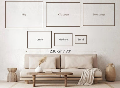 living room with wall art size guide next to a sofa and coffee table, showing dimensions for various frame sizes