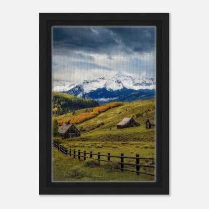 Framed canvas print of Telluride, Colorado, showcasing snow-capped mountains and rustic barns in a serene valley.