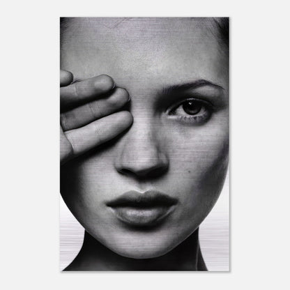 Black and white portrait of Kate Moss on brushed metal, showcasing timeless beauty and modern aesthetic.