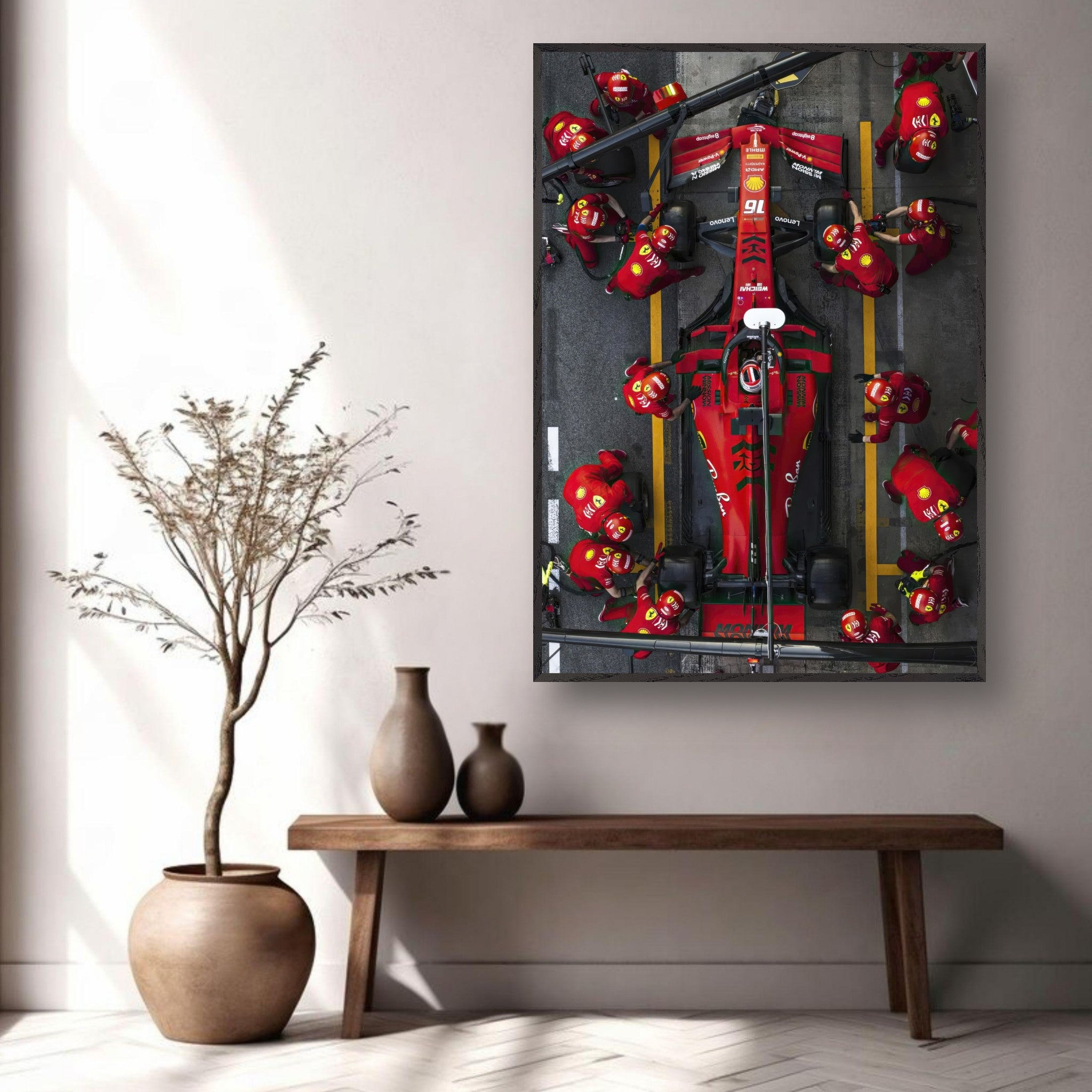 Framed fine art print of Ferrari Formula 1 pitstop showcasing teamwork and precision in vibrant colors and detailed design.