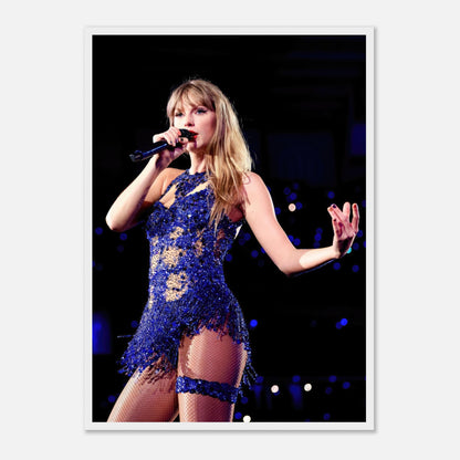 Taylor Swift performing in a dazzling blue outfit, captured in a high-resolution framed print for music fans.