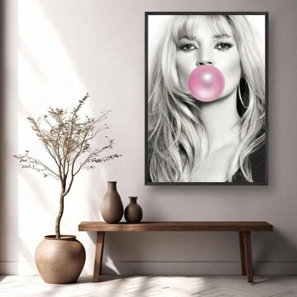 Kate Moss vintage framed print featuring black-and-white portrait with pink bubble gum, displayed in modern interior setting.