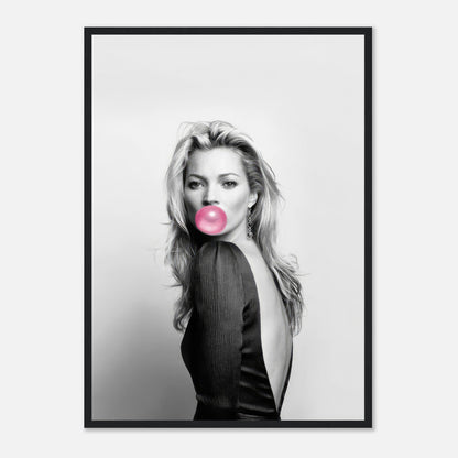 Kate Moss framed print in black and white with pink bubble gum accent, adding modern sophistication to any space.