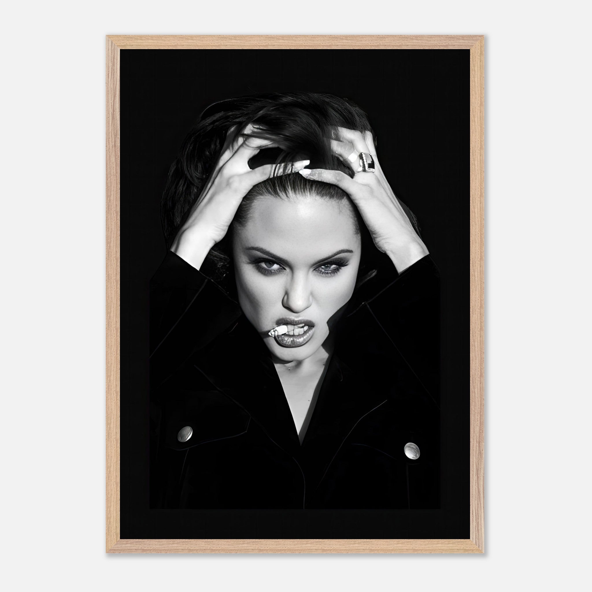 Vintage framed print of a glamorous woman with striking features, embodying Hollywood charisma in black-and-white.