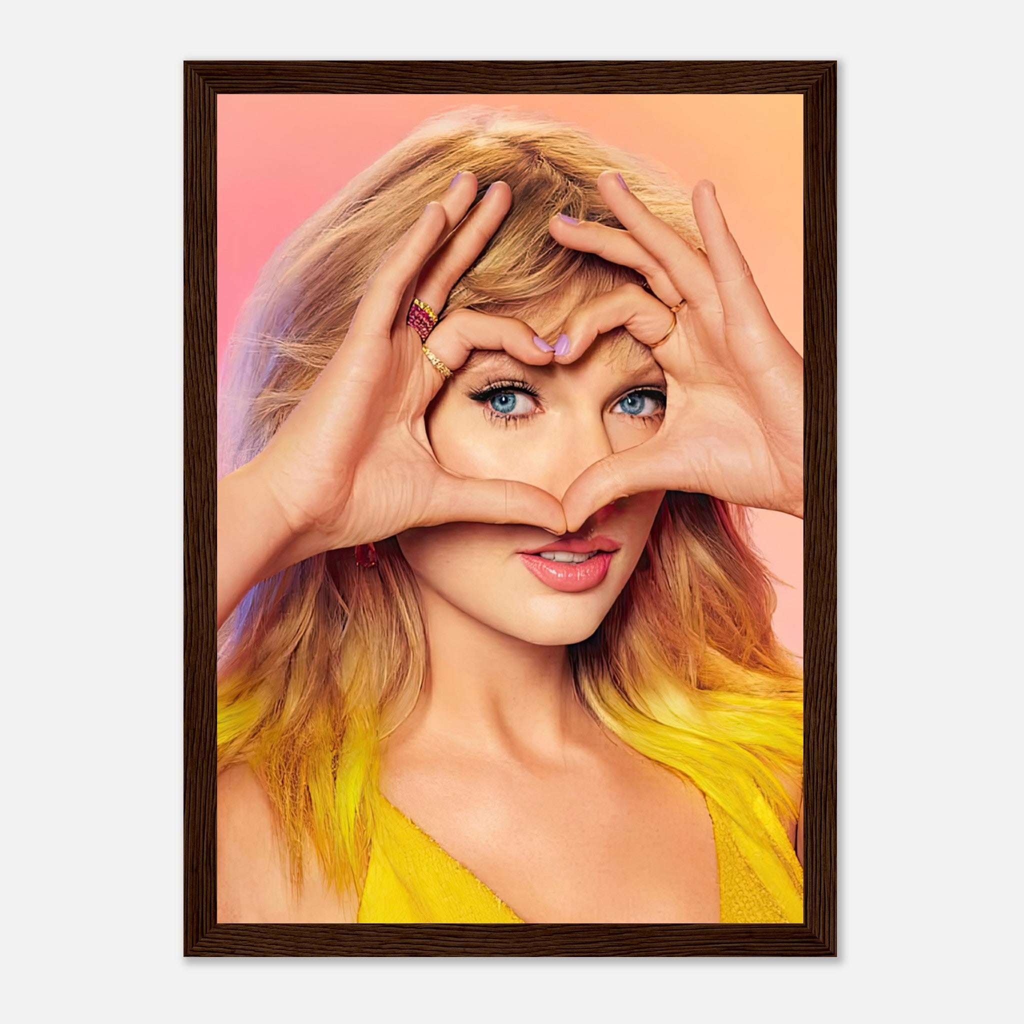 Taylor Swift framed print featuring her making a heart shape with hands, vibrant colors, and capturing her charm.