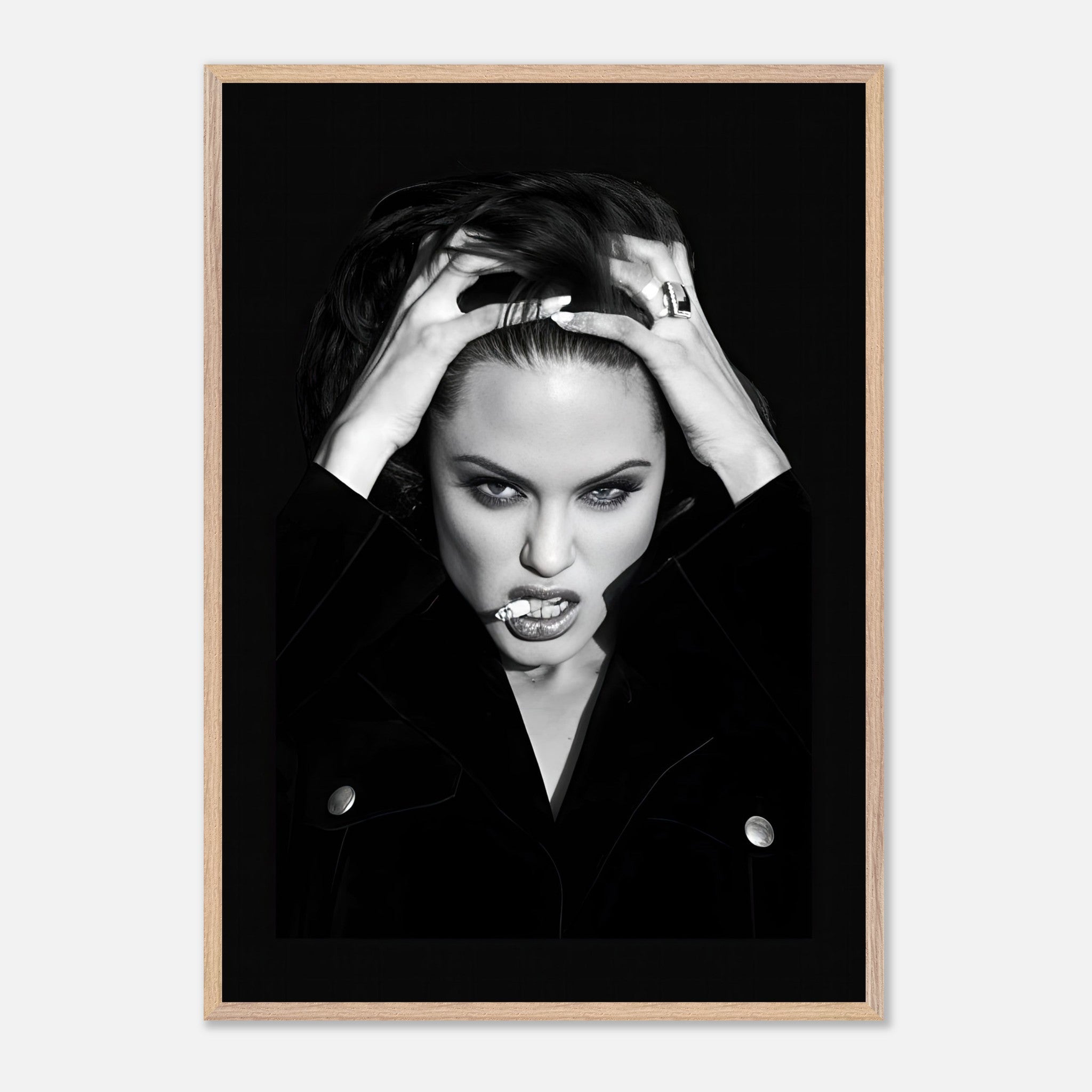 Angelina Jolie vintage framed print showcasing striking black-and-white photography with bold charisma and attitude.