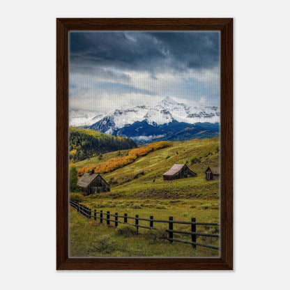 Framed canvas print of Telluride, Colorado featuring snow-capped mountains and rustic barns in a valley.