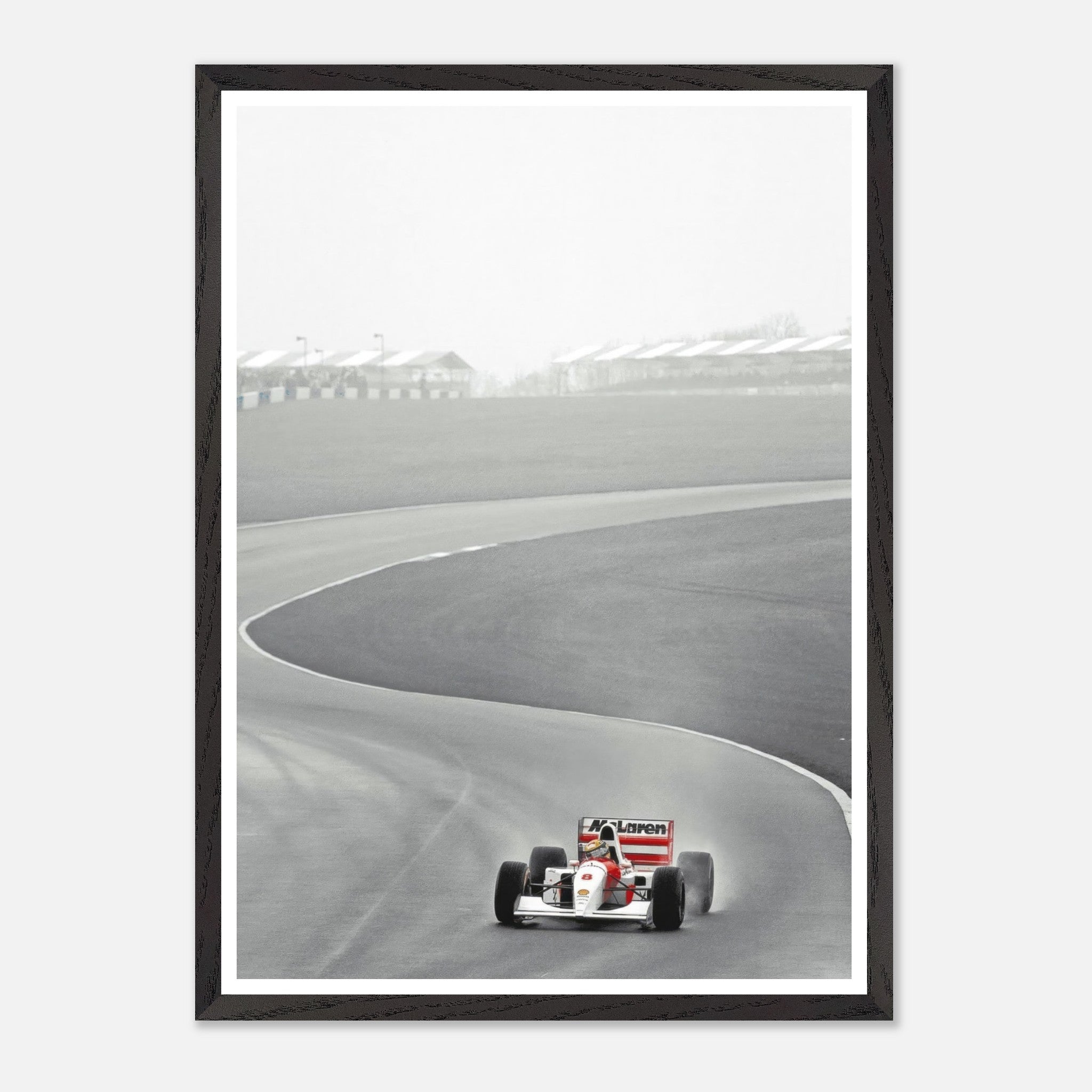 Ayrton Senna racing the McLaren MP4/4 on a track, captured in vintage framed photography from 1988.