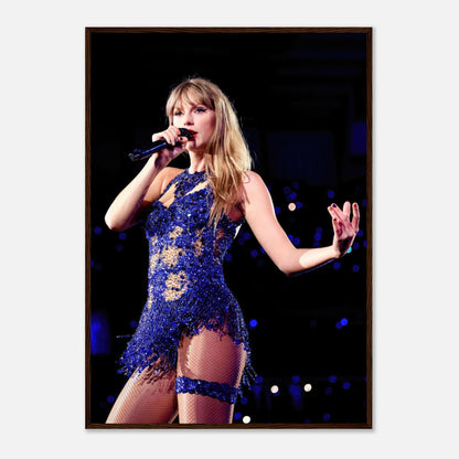 Taylor Swift performing in a dazzling blue outfit, captured in a stunning framed print for fans and music lovers.