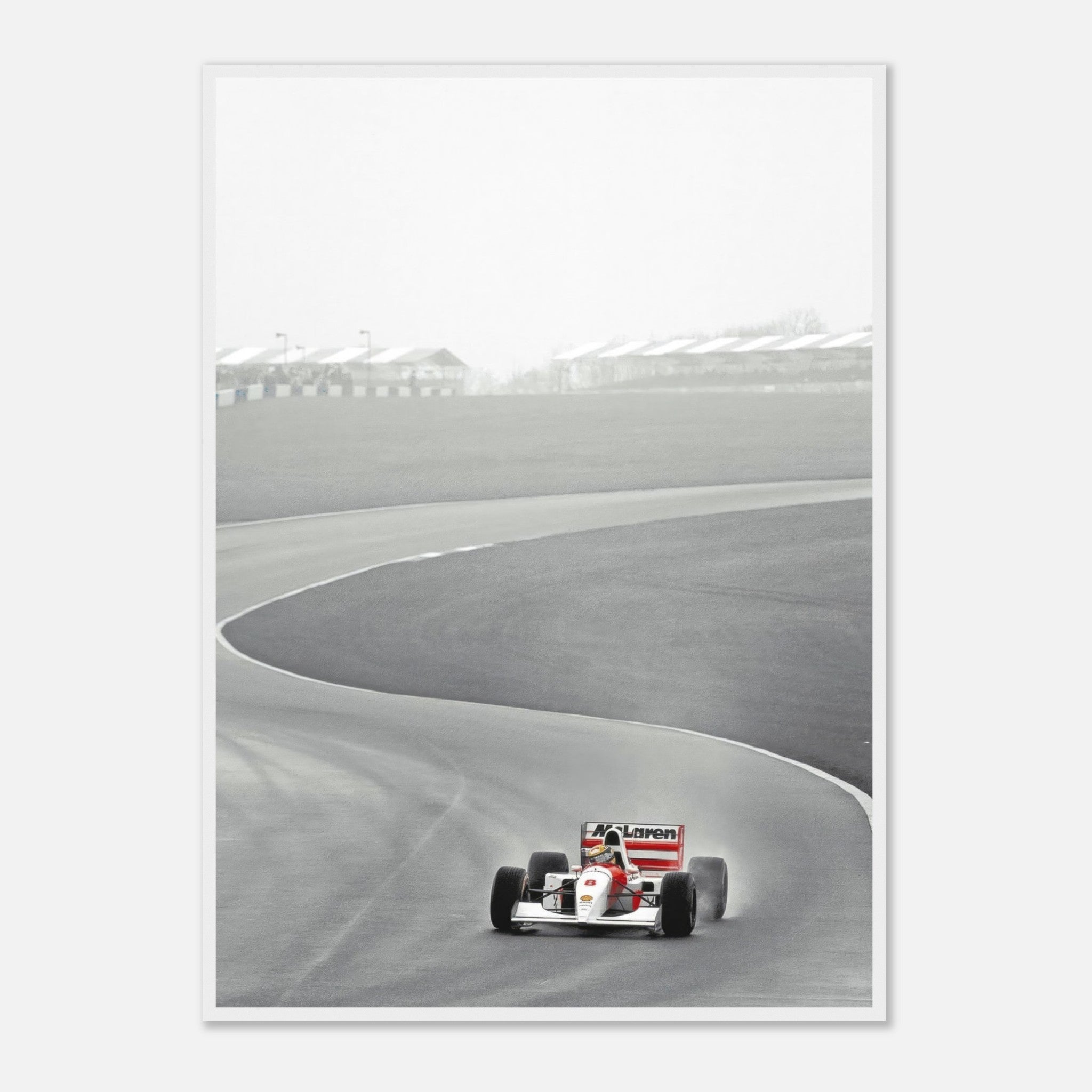 Ayrton Senna driving the McLaren MP4/4 on track in 1988, framed black and white racing photography.