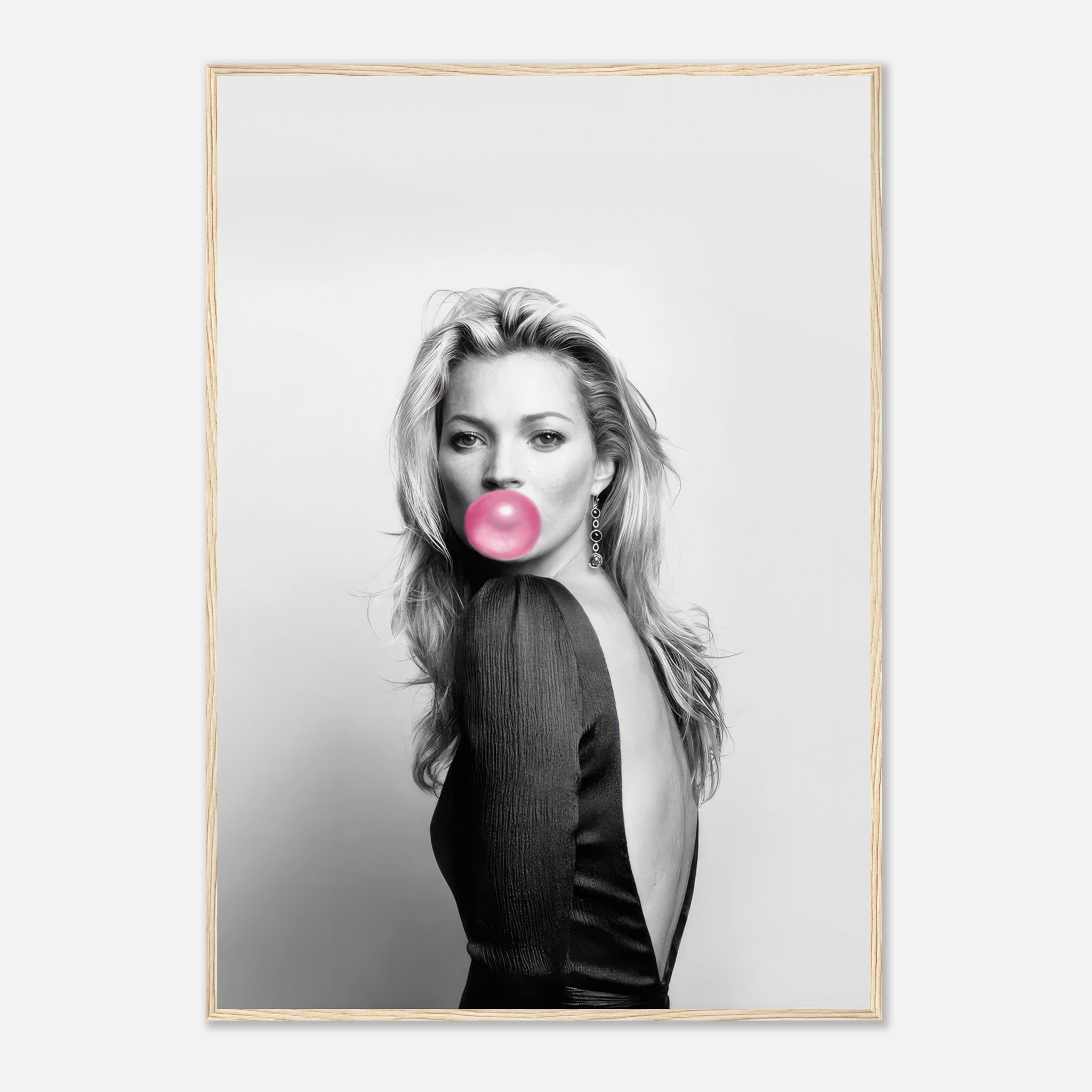 Kate Moss Bubble Gum Framed Print featuring a chic black-and-white portrait with a vibrant pink bubblegum accent.