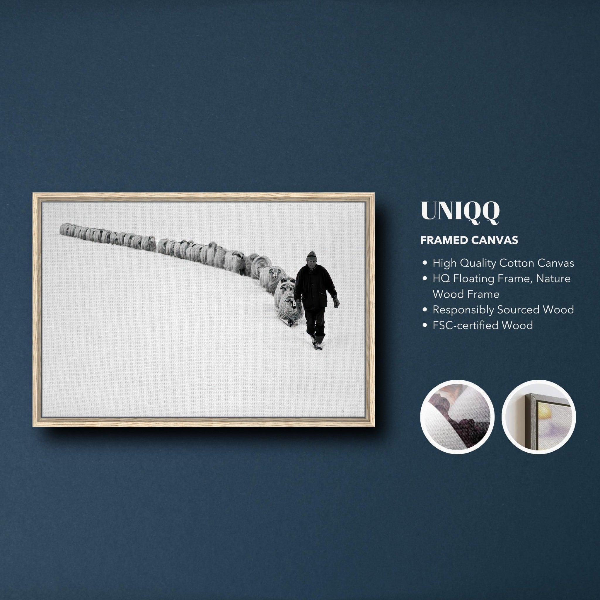 Black-and-white framed canvas print of a shepherd leading his flock through a snowy landscape.