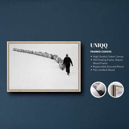 Black-and-white framed canvas print of a shepherd leading his flock through a snowy landscape.
