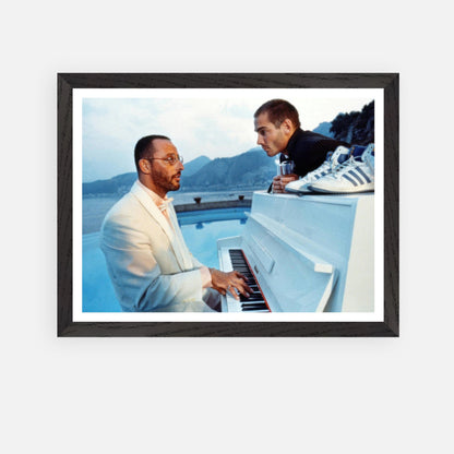 Jean Reno at the piano with a friend in a scenic seaside setting, vintage framed print from "The Big Blue."