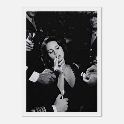 Lana Del Rey smoking in a striking black-and-white framed print surrounded by admirers, exuding vintage Hollywood charm.