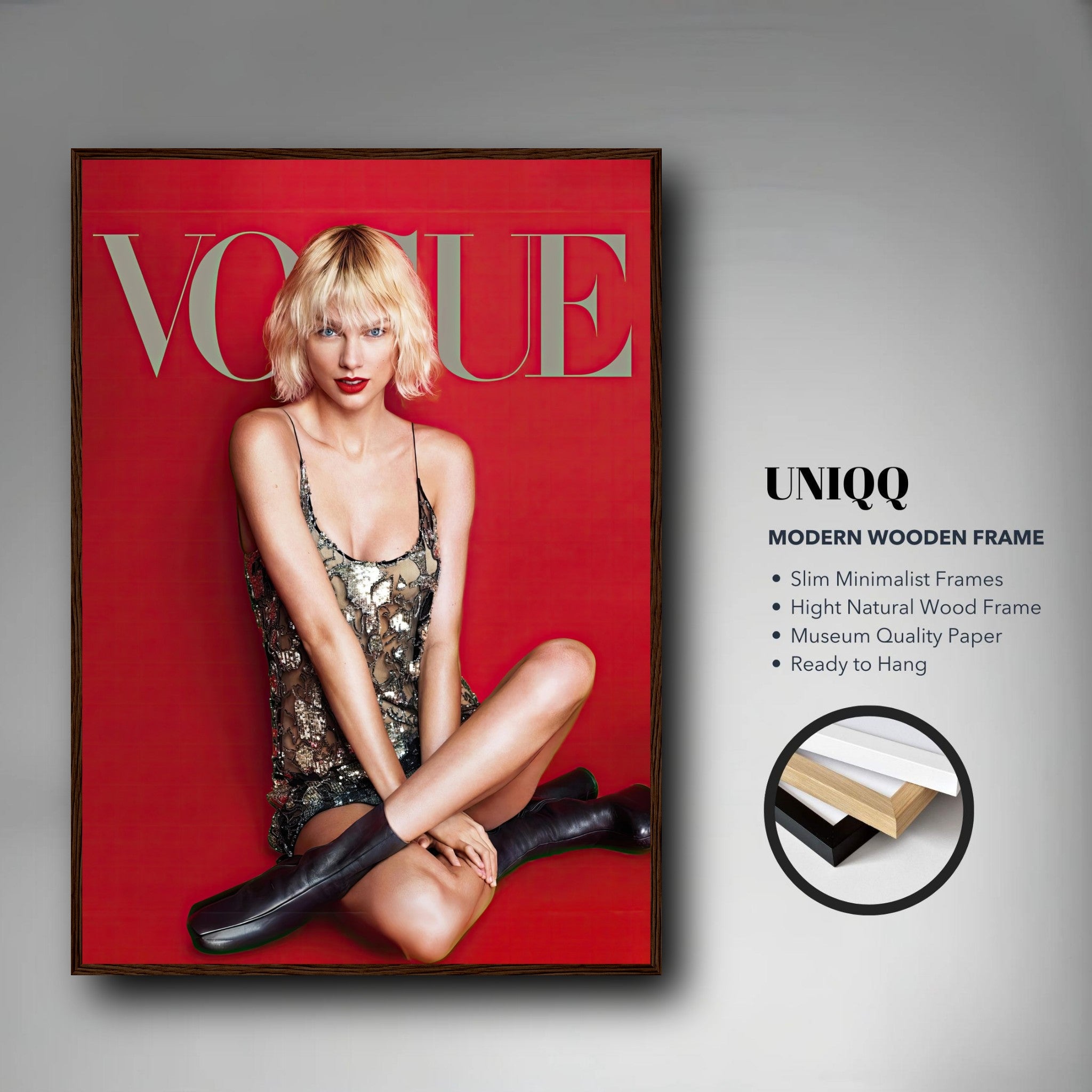 Taylor Swift Vogue framed poster featuring model in metallic dress, striking a confident pose against a red background.